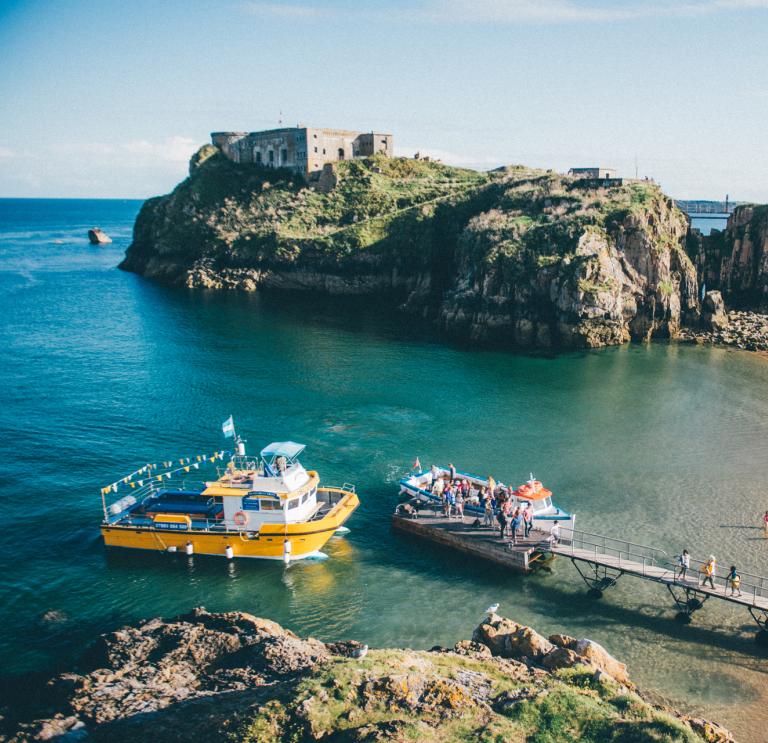 View of St Catherine's Fort on St Catherine's Island, and small boats picking up passengers from Tenby.