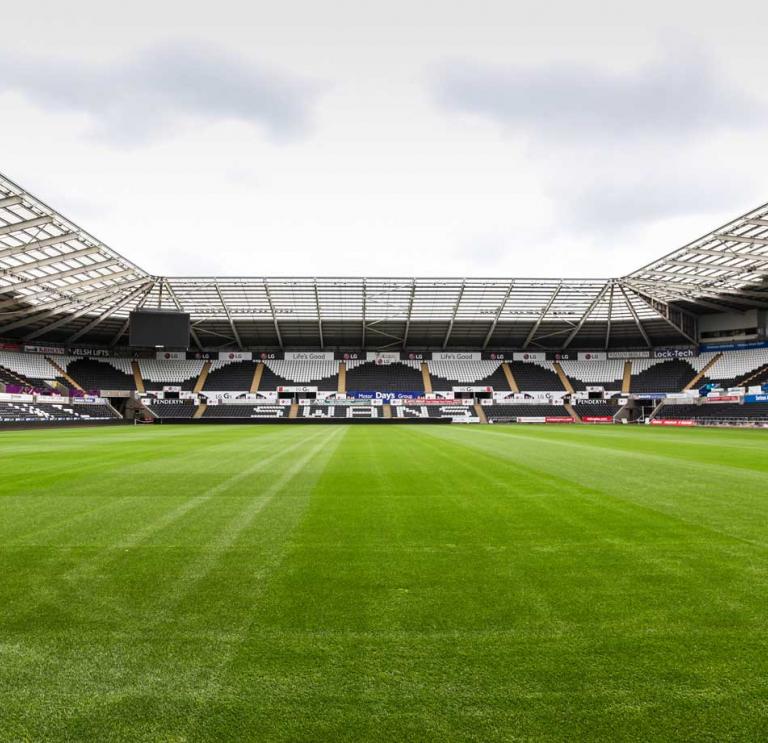 Wide angle shot Liberty Stadiums empty pitch in Swansea
