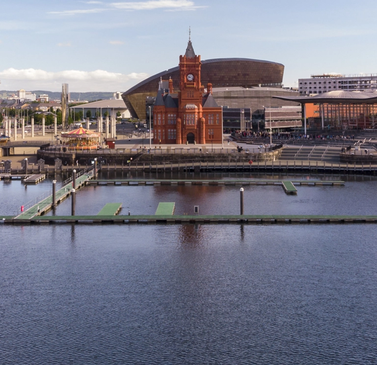 Landscape of the attractions at Cardiff Bay seen from the water.