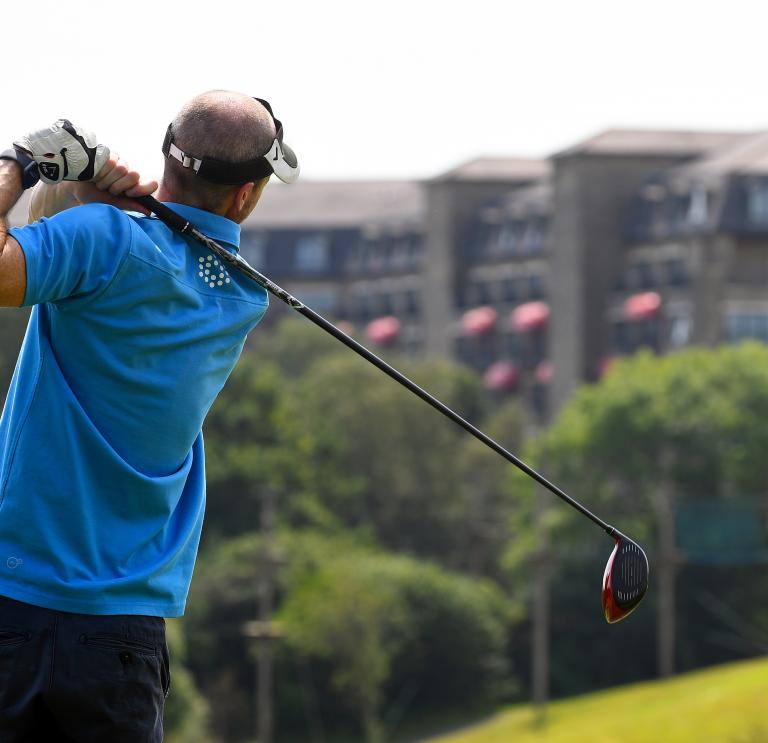 Golfer with driver club at the Celtic Manor Resort.