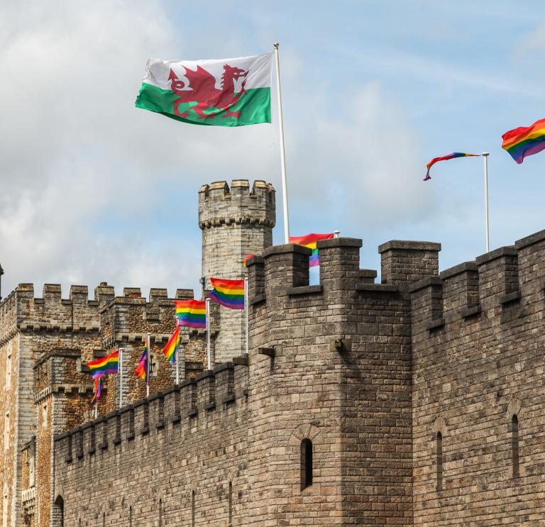Cardiff Castle with Pride and Y Ddraig Goch flags flying