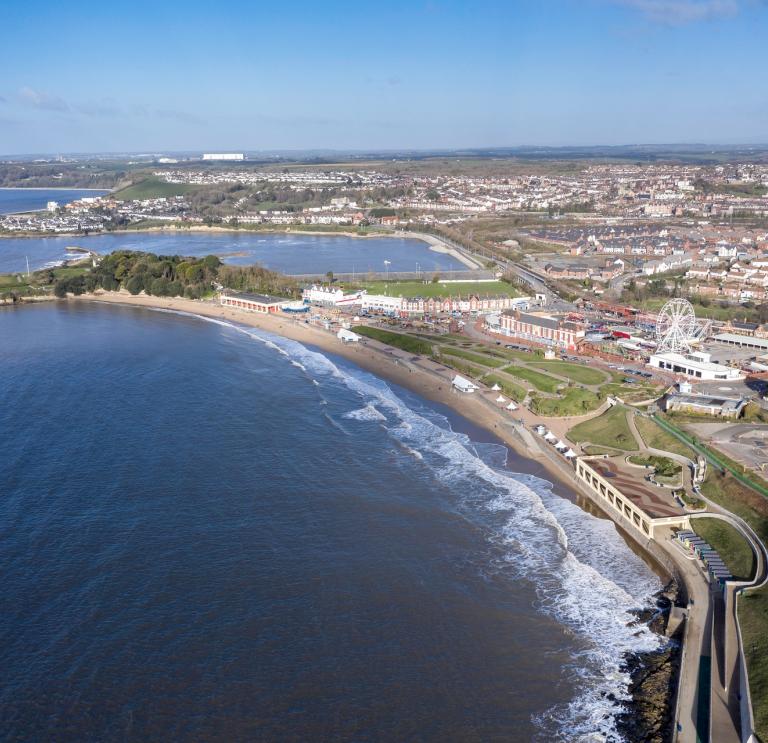Barry Island from above showing funfair and beach.
