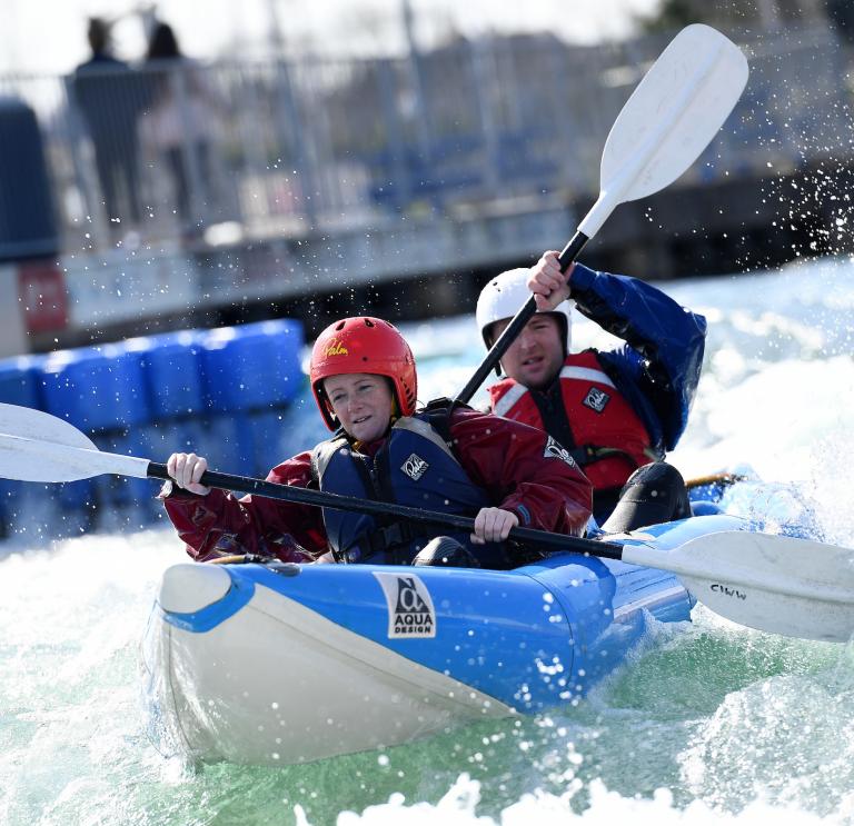 two people white water rafting at Cardiff International White Water.