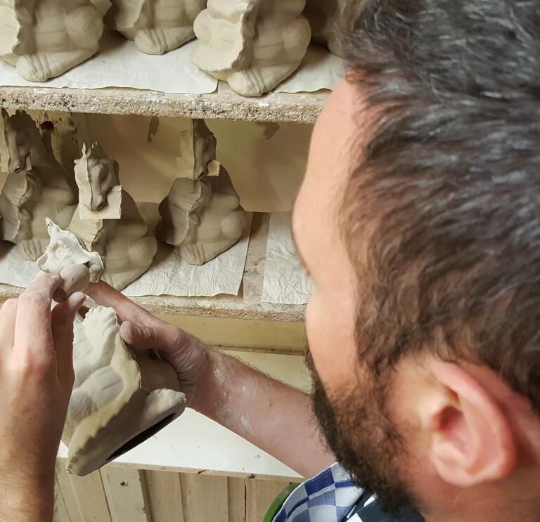 A man crafting with clay.