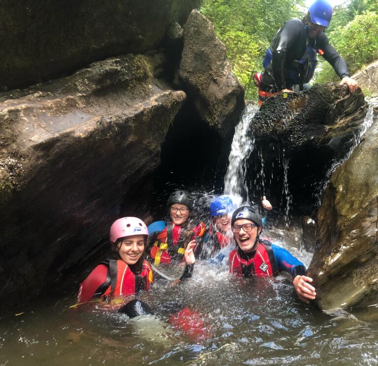 group of gorge walkers in water.