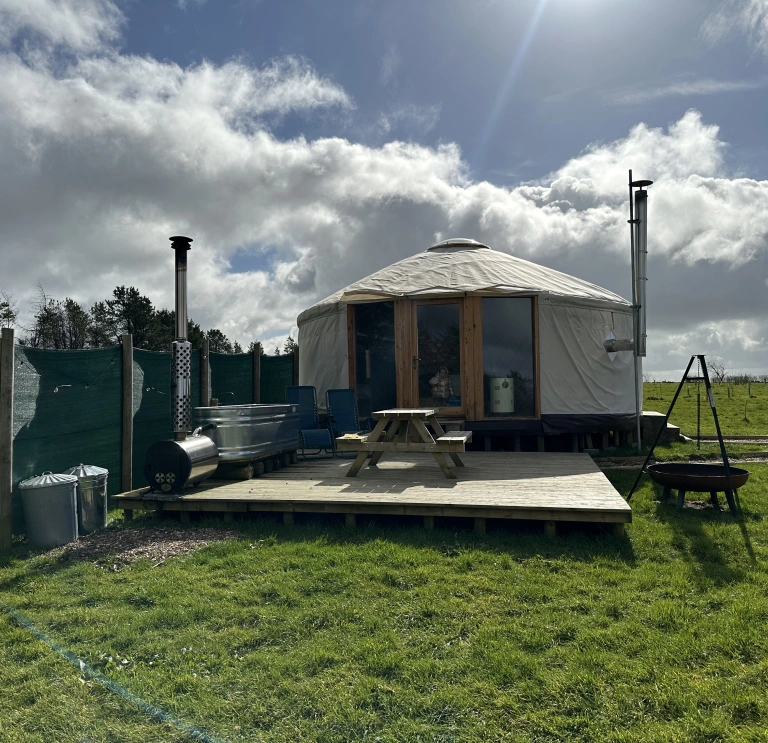 exterior of yurt and outside area.