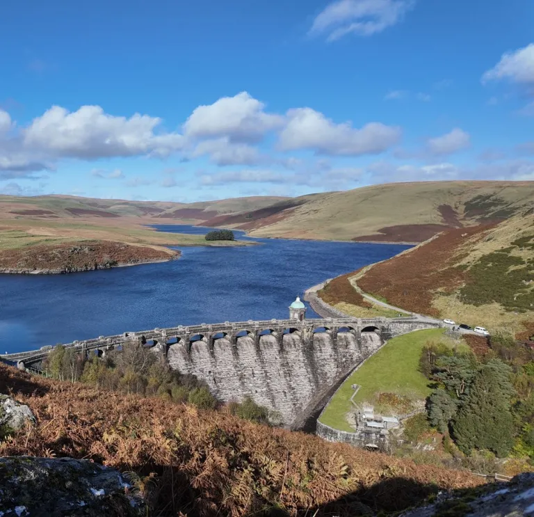 dam and reseivoir on sunny day.