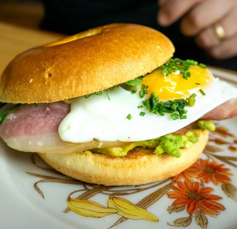 Brunch bap with a fried egg on a plate