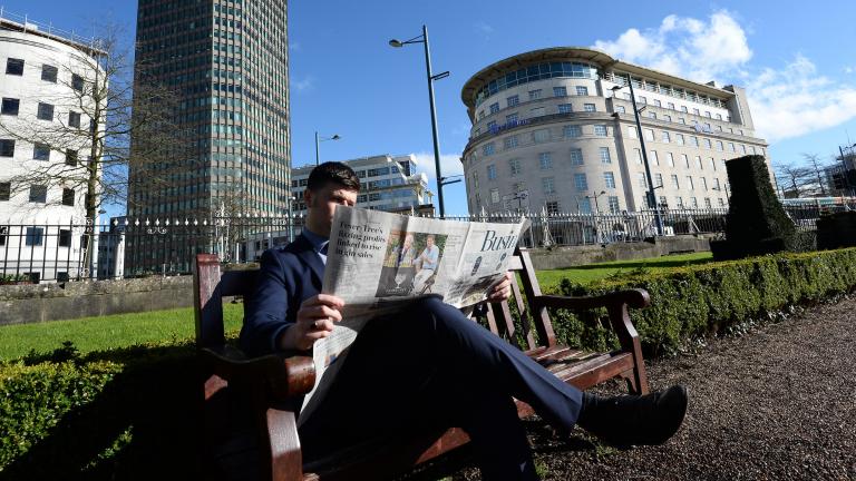 Reading the news in Cardiff
