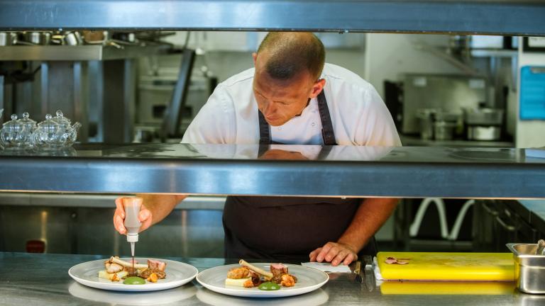 chef plating up food.