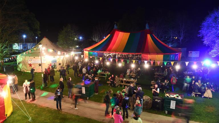 Festival tents lit up at night