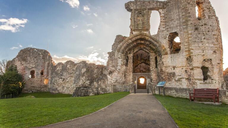 Crumbling castle with archway.