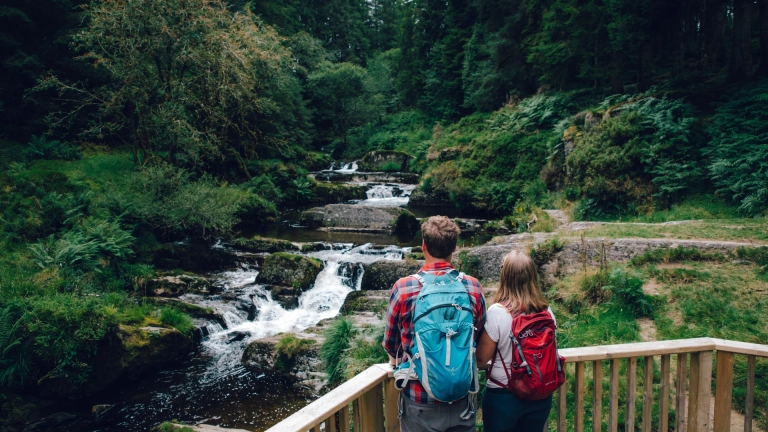 couple looking at river from platform.