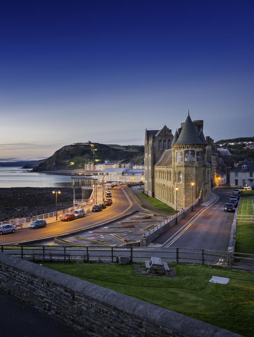 The view of Aberystwyth prom at dusk from the castle.
