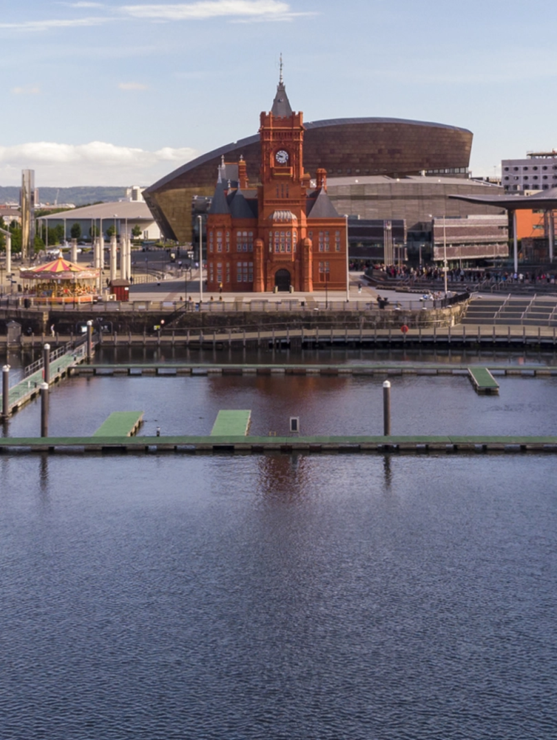 Landscape of the attractions at Cardiff Bay seen from the water.