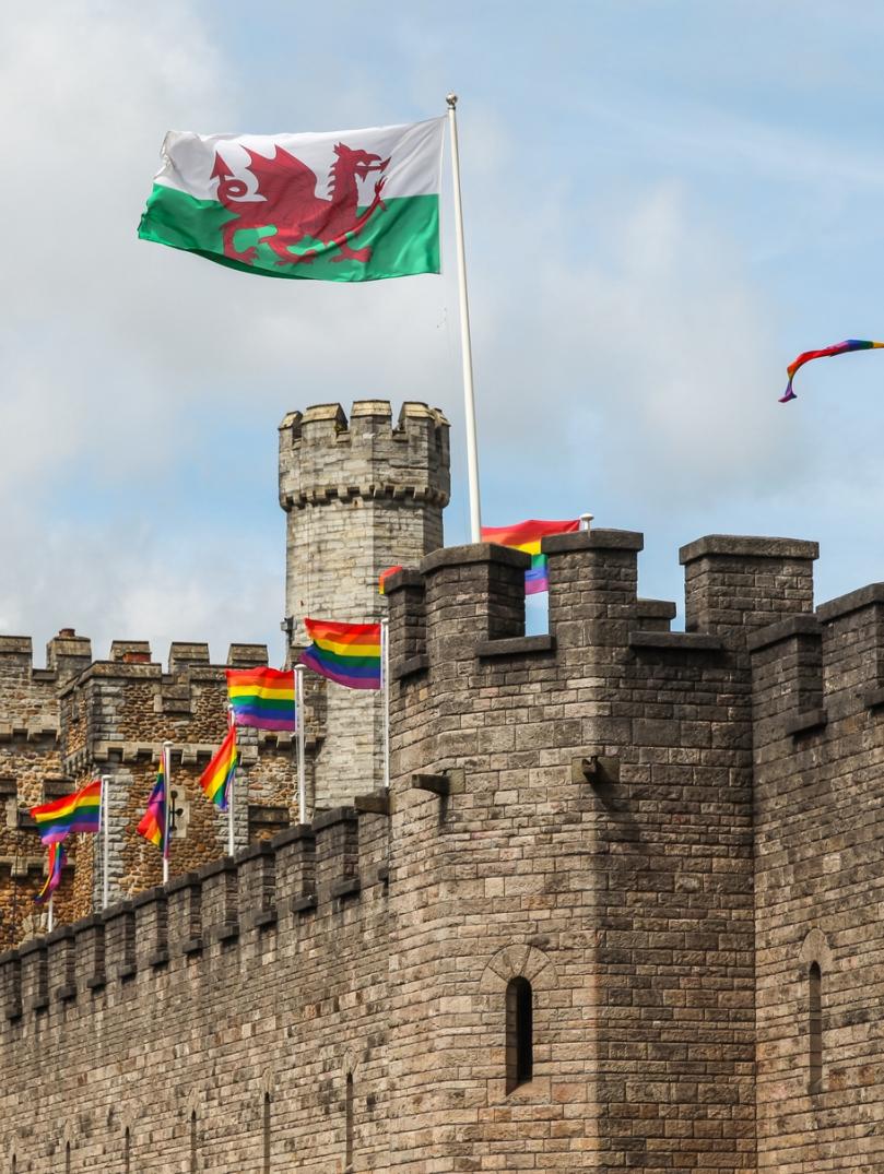 Cardiff Castle with Pride and Y Ddraig Goch flags flying