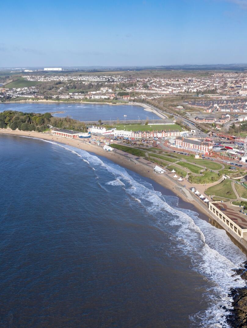 Barry Island from above showing funfair and beach.
