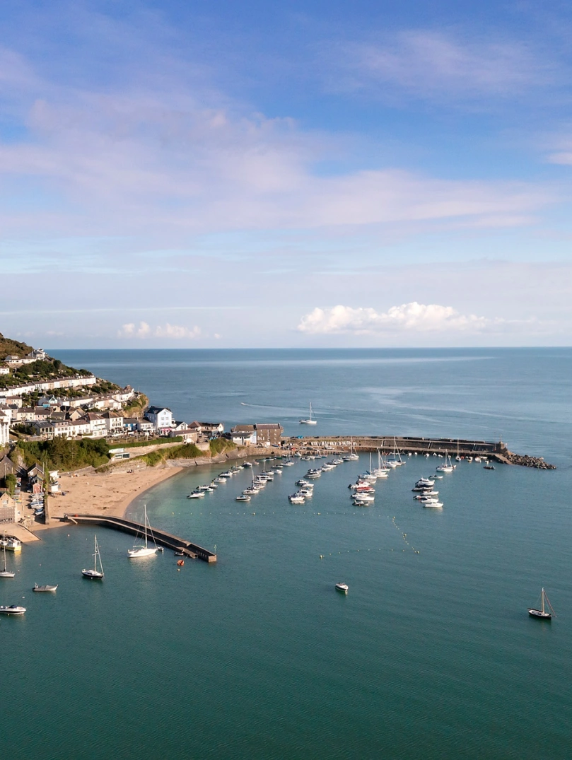 A coastal  harbour town with boats in the bay.
