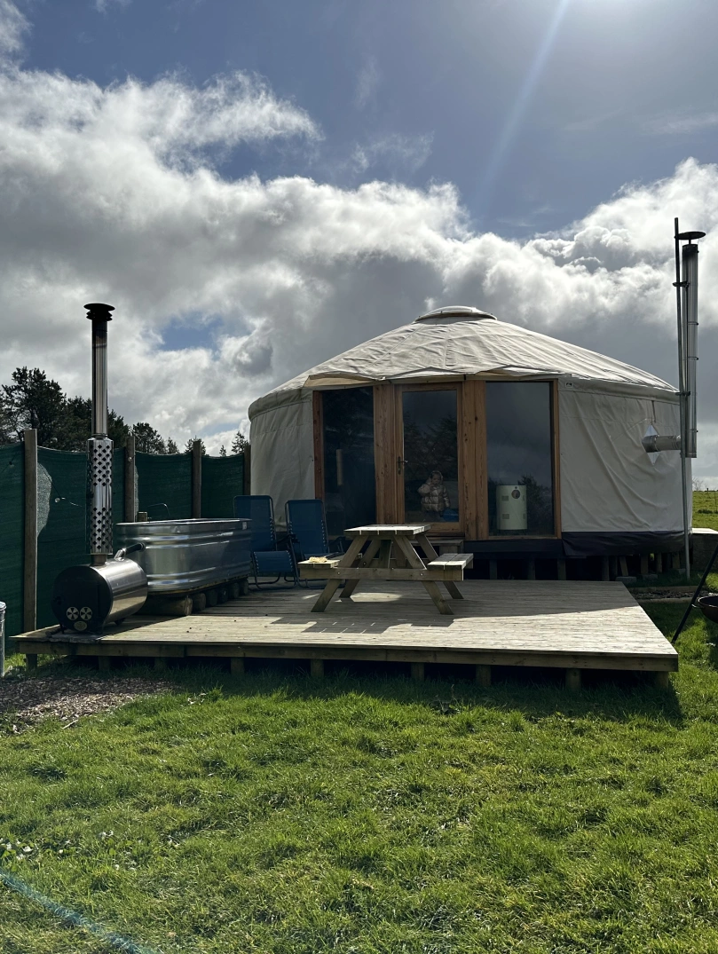 exterior of yurt and outside area.