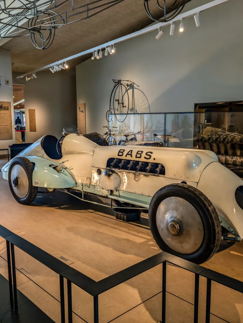 An old racing car in a museum.