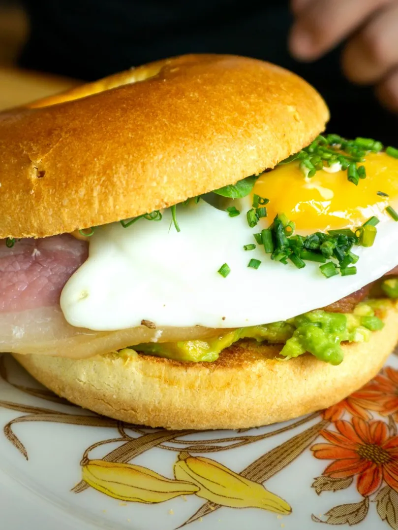 Brunch bap with a fried egg on a plate