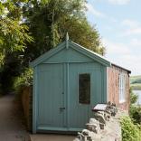 A writing shed looking out over an estuary.