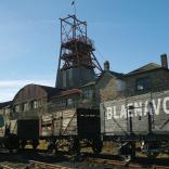 Wagons and the pit head tower at Big Pit.
