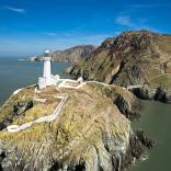 Image of South Stack Lighthouse from above, perched on a clifftop.