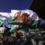 Welsh flags against a blue sky