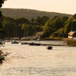 River Teifi in low light with boats on the river near a harbour..