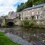 Stone houses and bridge in Beddgelert by the river.
