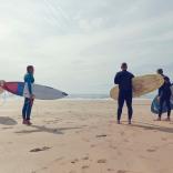 four surfers on on freshwater west beach