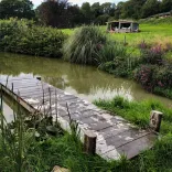 lake with cabin in background.