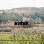 Five people on a massive swing.