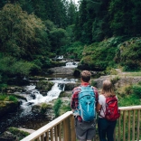 couple looking at river from platform.