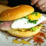 Brunch bap with a fried egg on a plate