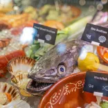 Fresh seafood display featuring monkfish, scallops and shellfish on ice at The Custom House