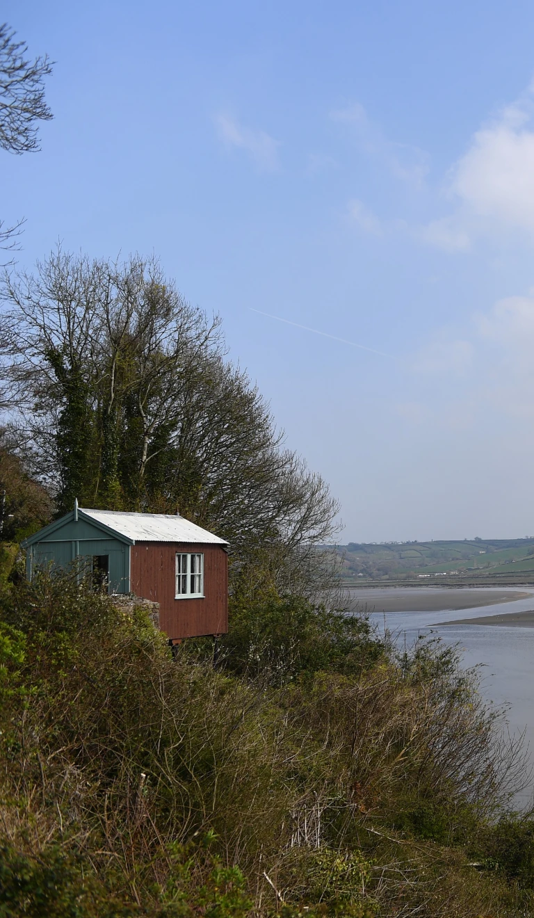 Dylan Thomas' writing shed - a small wooden shed overlooking an estuary.