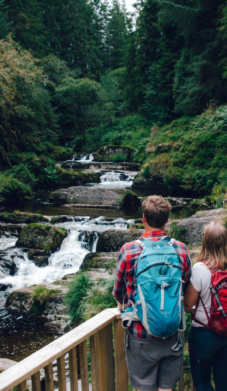 couple looking at river from platform.