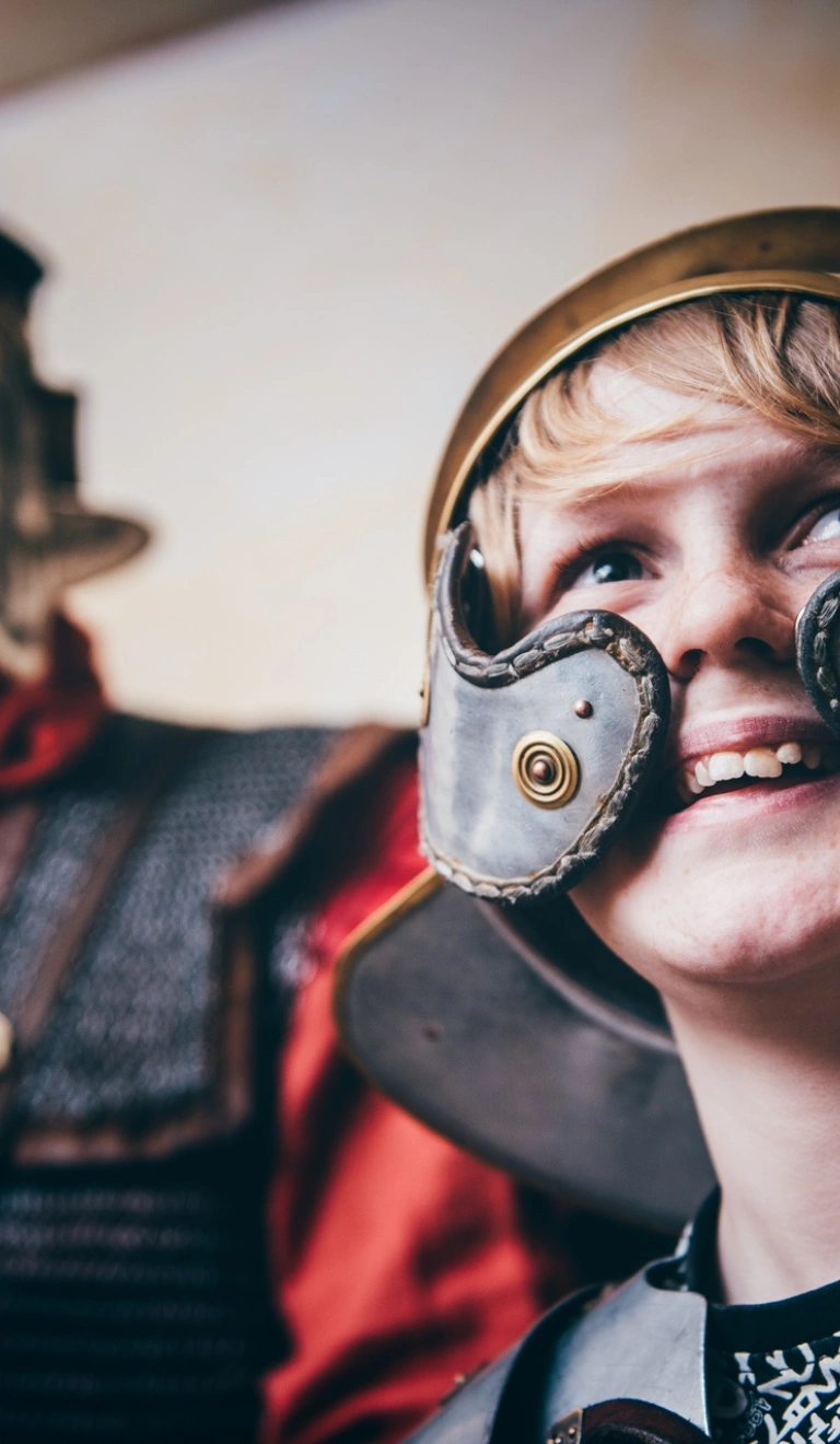 boy wearing roman costume.