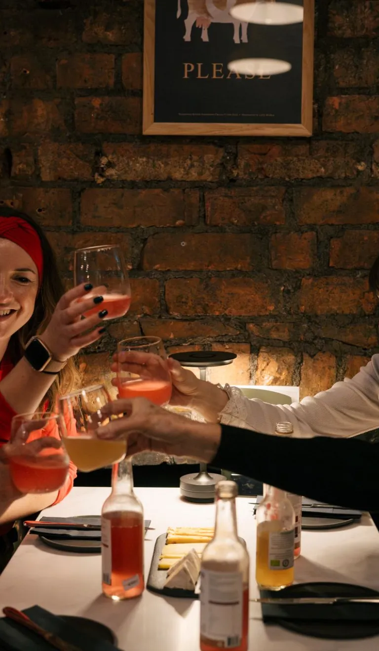 group of women and girl at table with drinks.